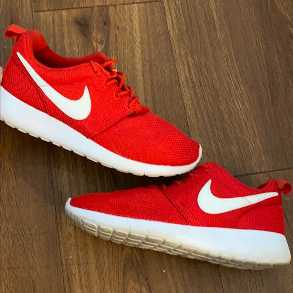 Nike , red running shoes